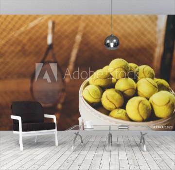 Picture of Tennis balls at hopper tennis racket in the blurred background sportive and healthy lifestyle